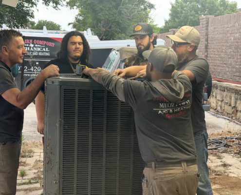 technicians doing ac repair