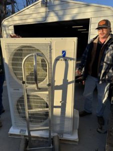 technician repairing an ac