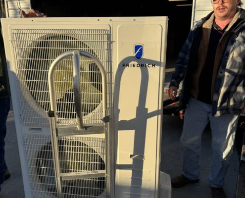 technician repairing an ac