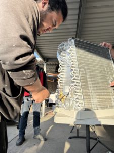 technician installing mini split ac